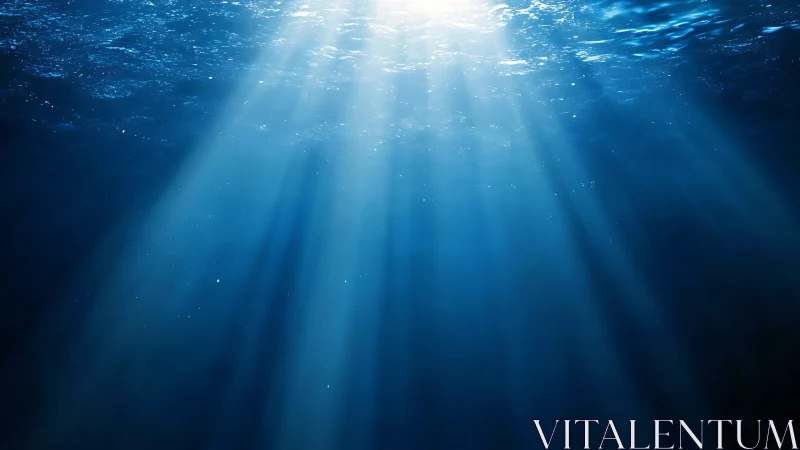 Sunlight beams piercing deep blue underwater space.