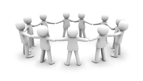 Rendered white figures stand in a closed ring formation