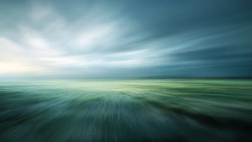 Dynamic motion-blur seascape under moody cyan sky.
