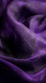 Velvet purple textile folds with luminous woven texture.