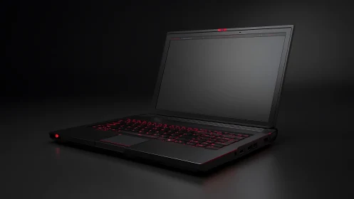 Matte black gaming laptop with red backlit keyboard on dark surface