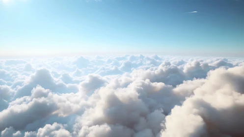 Cloud layer fills frame under clear blue sky at high altitude