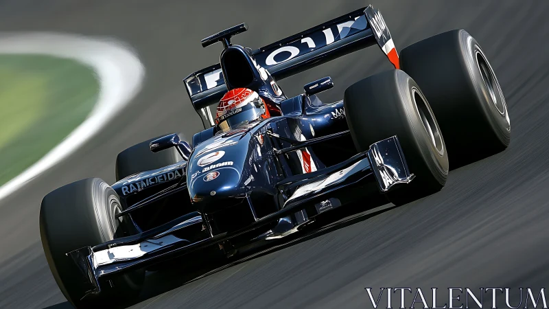 Formula race car on asphalt circuit under motion blur effect.