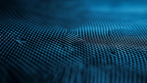 Rippling teal grid surface with soft depth of field focus.