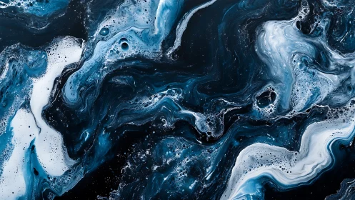 Abstract blue and white fluid swirl pattern on black background.
