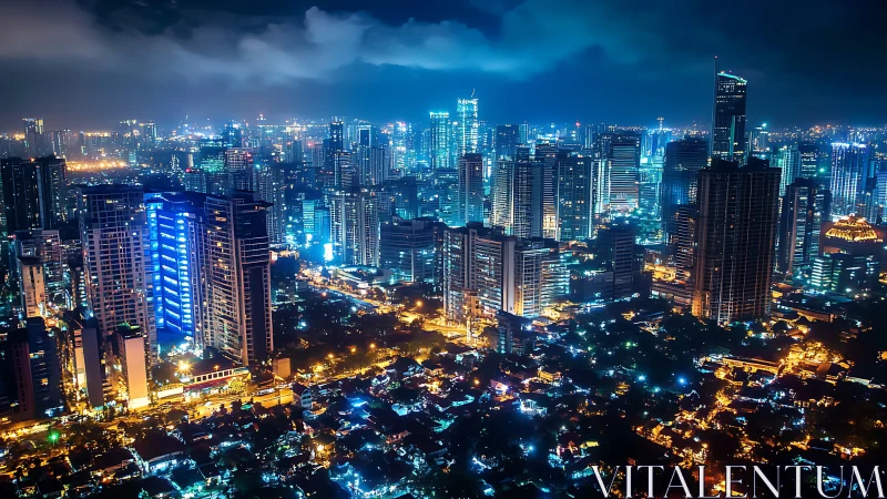 Dense modern city skyline glowing with blue night lights.
