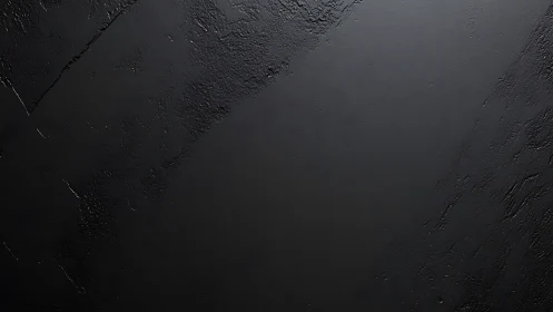 Quiet charcoal wall with softly shifting textured shadows.