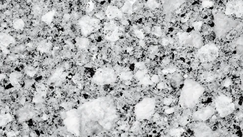 Granite surface shows coarse white and black crystalline pattern