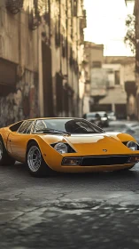 Yellow classic sports car parked on worn urban street.
