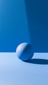 Monochrome blue sphere under hard directional lighting casts shadow
