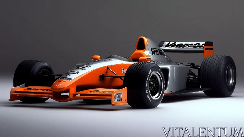 Orange and silver open-wheel racing car on neutral ground.