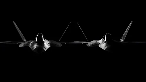 Two modern stealth fighter jets in dramatic low-key lighting.
