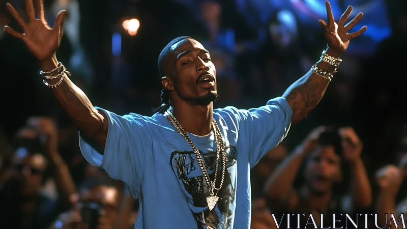 Performer raises both arms on stage before a dense audience