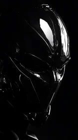 Glossy black sci fi helmet in stark low key lighting.