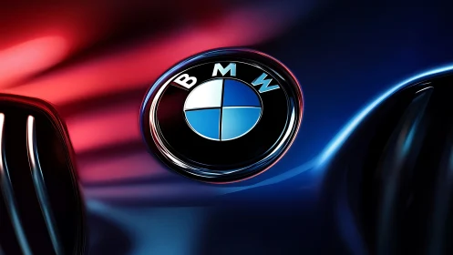 BMW hood emblem close-up with dramatic colored lighting.