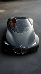 Futuristic BMW roadster glides under soft industrial light