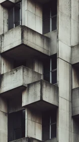 Concrete balconies form stacked geometric volumes on facade