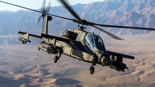 Attack helicopter flies over arid desert valley at low altitude