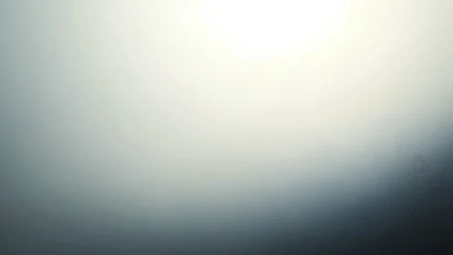 Subtle gradient light over softly textured surface.