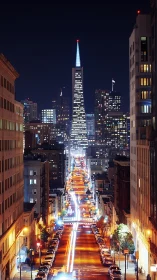 Transamerica Pyramid dominates night view above lit street