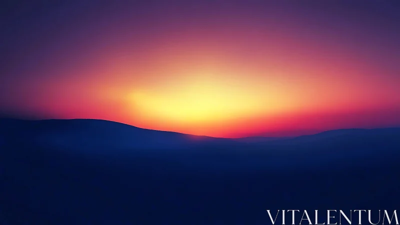 Vivid sunset glow above dark rolling mountain ridge.