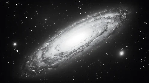 Inclined spiral galaxy core with luminous stellar halo field.