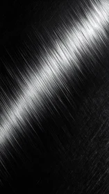 Silver streaks on shadowed metal, a quietly electric blur.