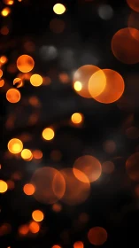 Warm Bokeh Lights Against Black Night Sky
