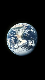 Earth from space with swirling clouds and polar ice cap.