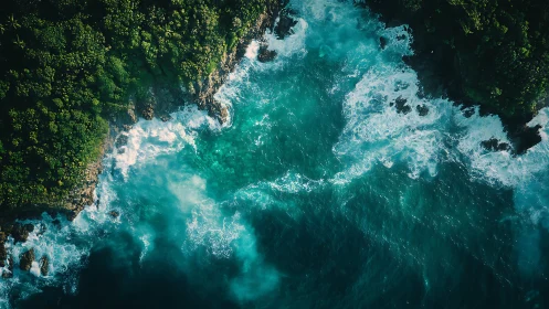 Tropical cliffline meets turquoise surf in aerial seascape.
