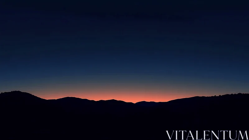 Midnight ridge waits under ember-sliced mountain horizon.