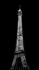 High-contrast nocturnal lattice tower in luminous silhouette.