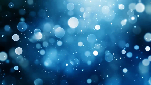 Blue abstract bokeh lights with floating white particles.