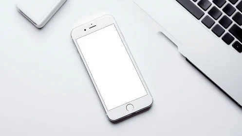 Minimalist Tech Workspace: Luminous Device Among Digital Tools.