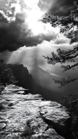 Sunbeams break storm clouds above high canyon rim