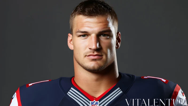 Football player portrait in dark uniform studio shot.