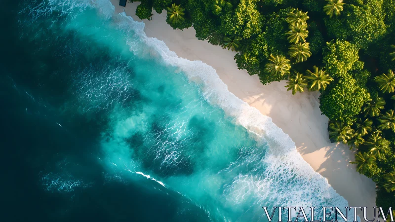 Aerial view of turquoise waves crashing on pristine sandy beach.