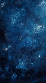 Textured blue abstract surface with dark tonal variations.