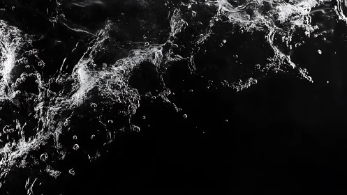 Shimmering water splash frozen against deep black void.