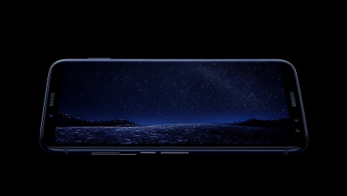 Galaxy horizon unfolds inside a midnight smartphone screen.