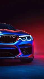 Front view shows illuminated BMW sports sedan in neon light