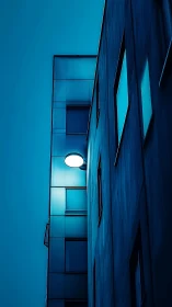 Cool blue city corner glows softly in the evening hush