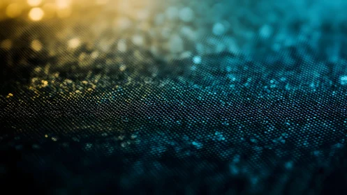 Abstract macro of shimmering fabric texture in blue and gold light.