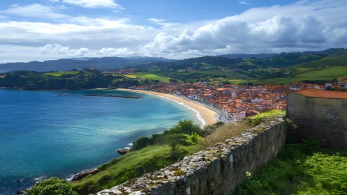 Wide-angle coastal panorama of Spanish bay, village and hills