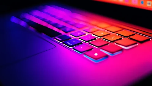 Neon-gradient keyboard close-up with cinematic shallow focus.