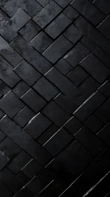 Dark textured black brick wall with diagonal pattern design.