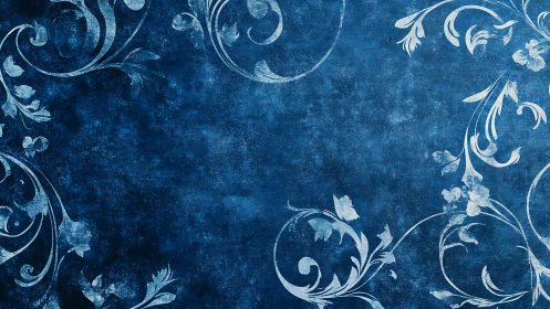 Ornamental cyanotype scrollwork on distressed indigo field.