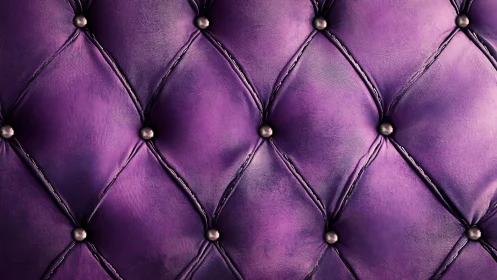 Diamond-tufted purple leather upholstery with metallic button fasteners