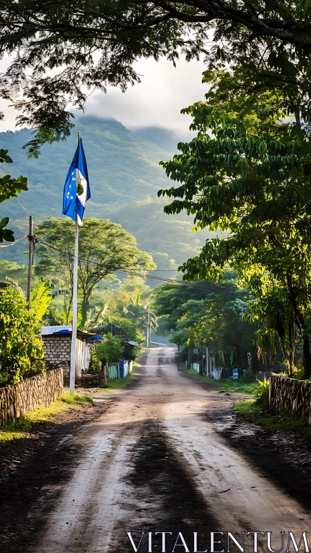 Morning mist crowns a rural road beneath emerald hills