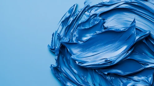 Rich blue paint textures swirl in a bold minimalist composition